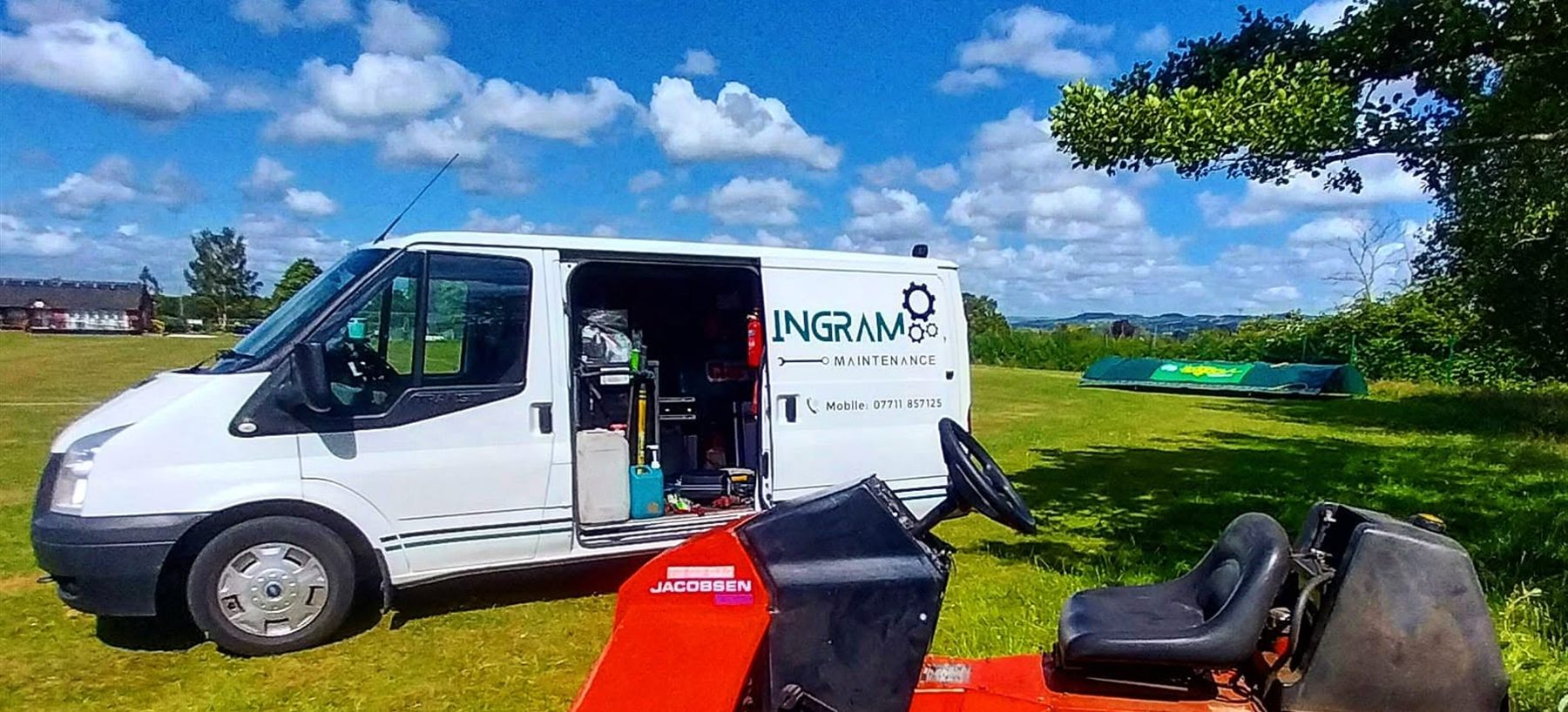 The Ingram Maintenance van beside a Jacobsen Tri-King triple mower on a golf course