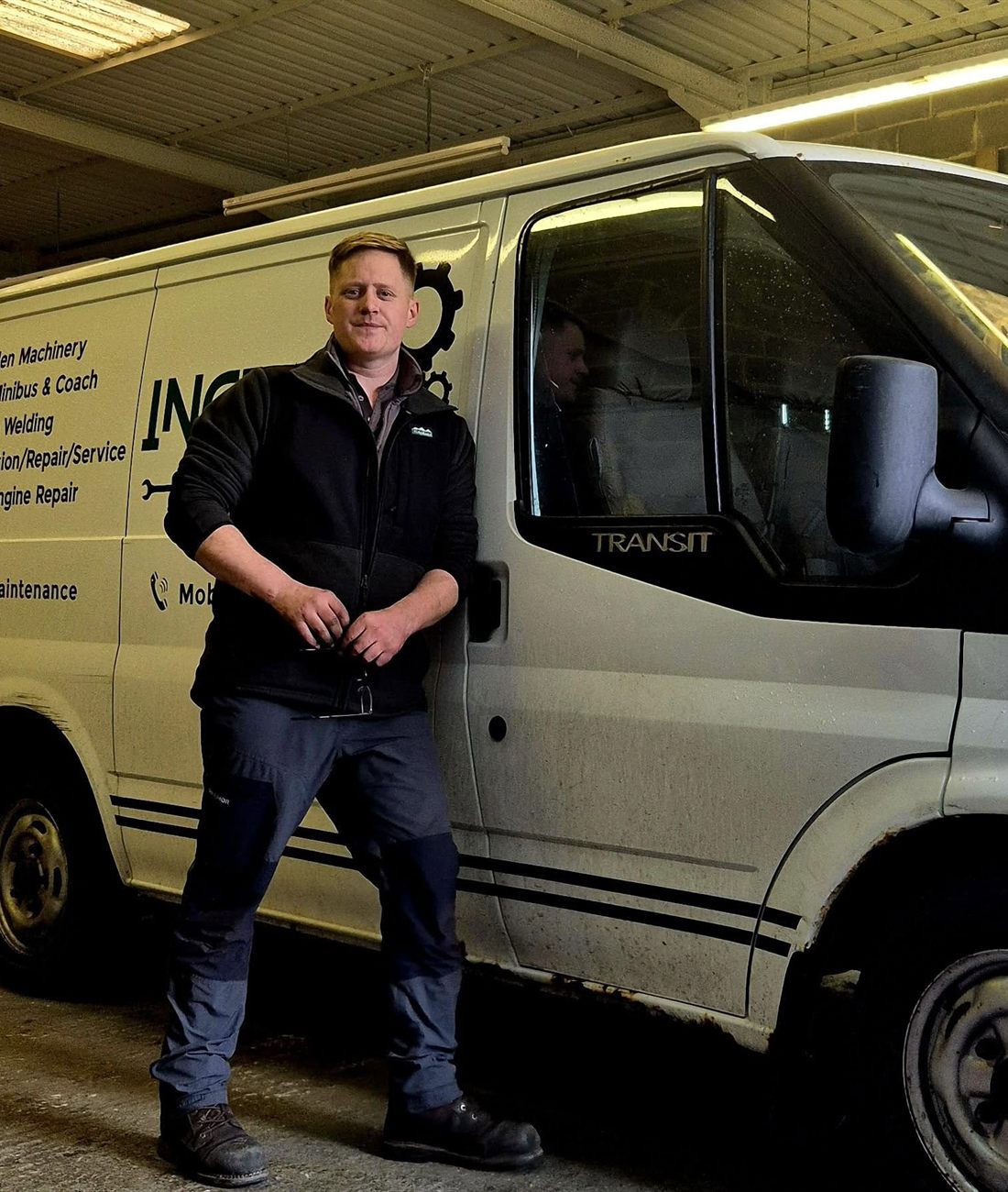Ben Ingram stood beside the Ingram Maintenance Transit, with the service list signwritten on the side door