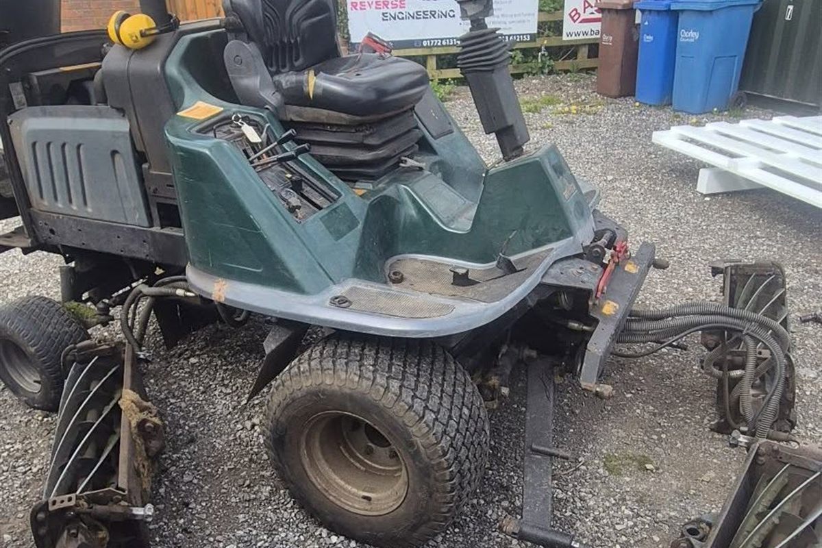 A Hayter LT324 cylinder mower stripped down with the cutting units removed