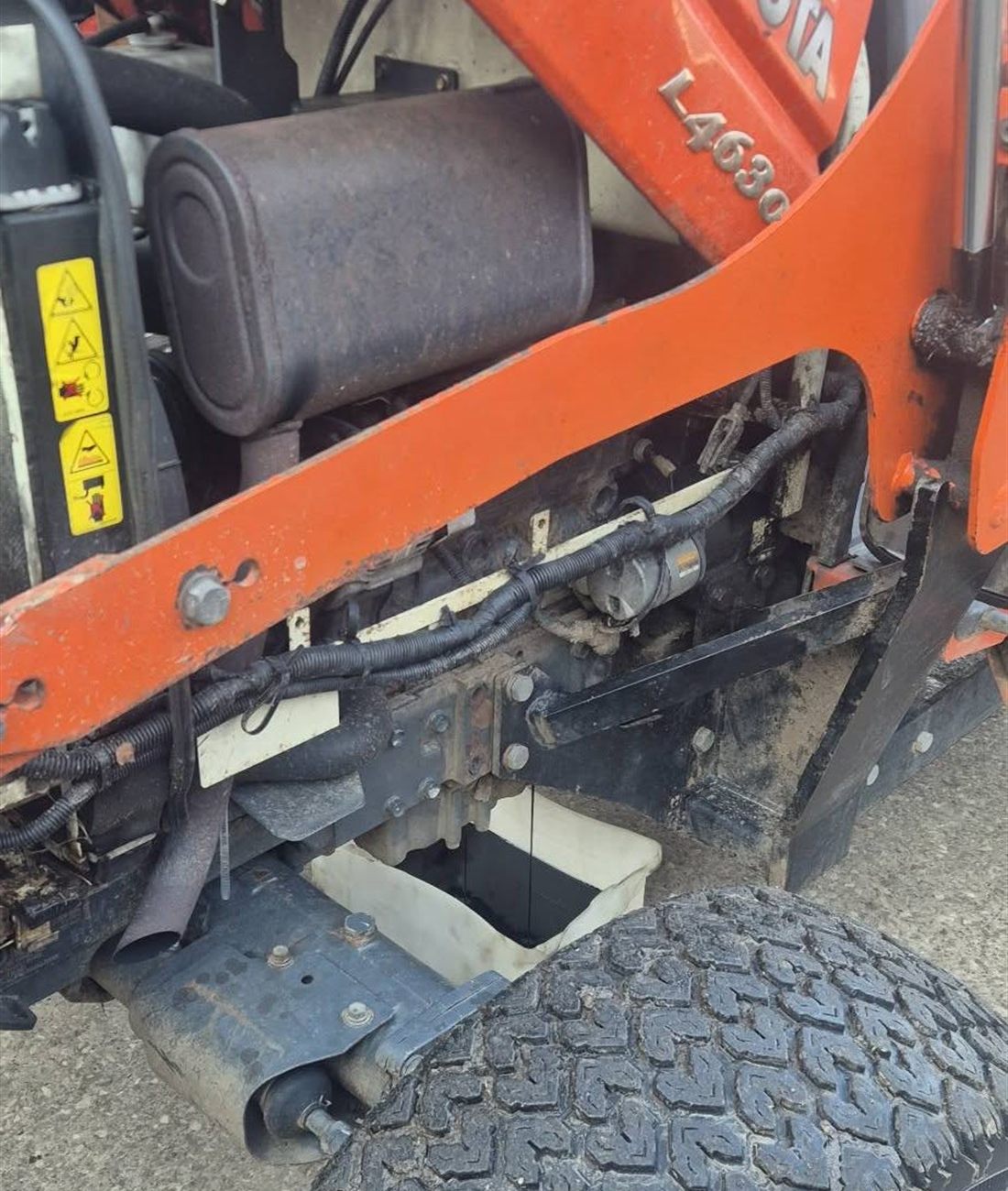 The engine bay of a Kubota L4630 with the bonnet raised